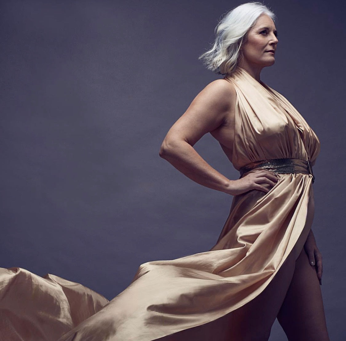 Rachel Peru Wearing gold gown, grey hair became model in her 40's 